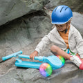 kid sitting next to blue bloom kick scooter