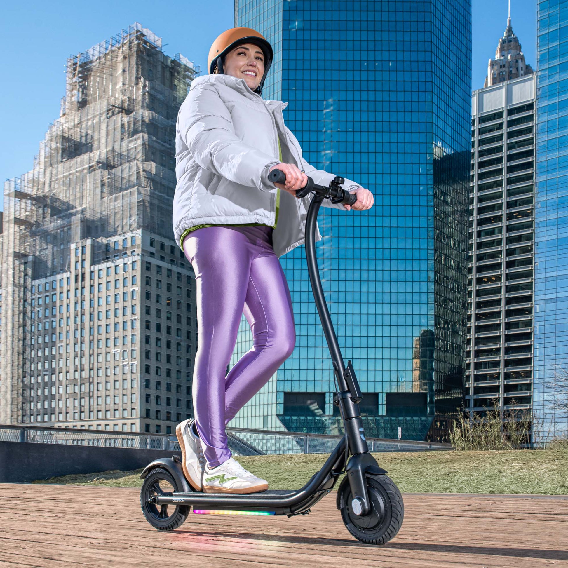 woman riding ember e-scooter