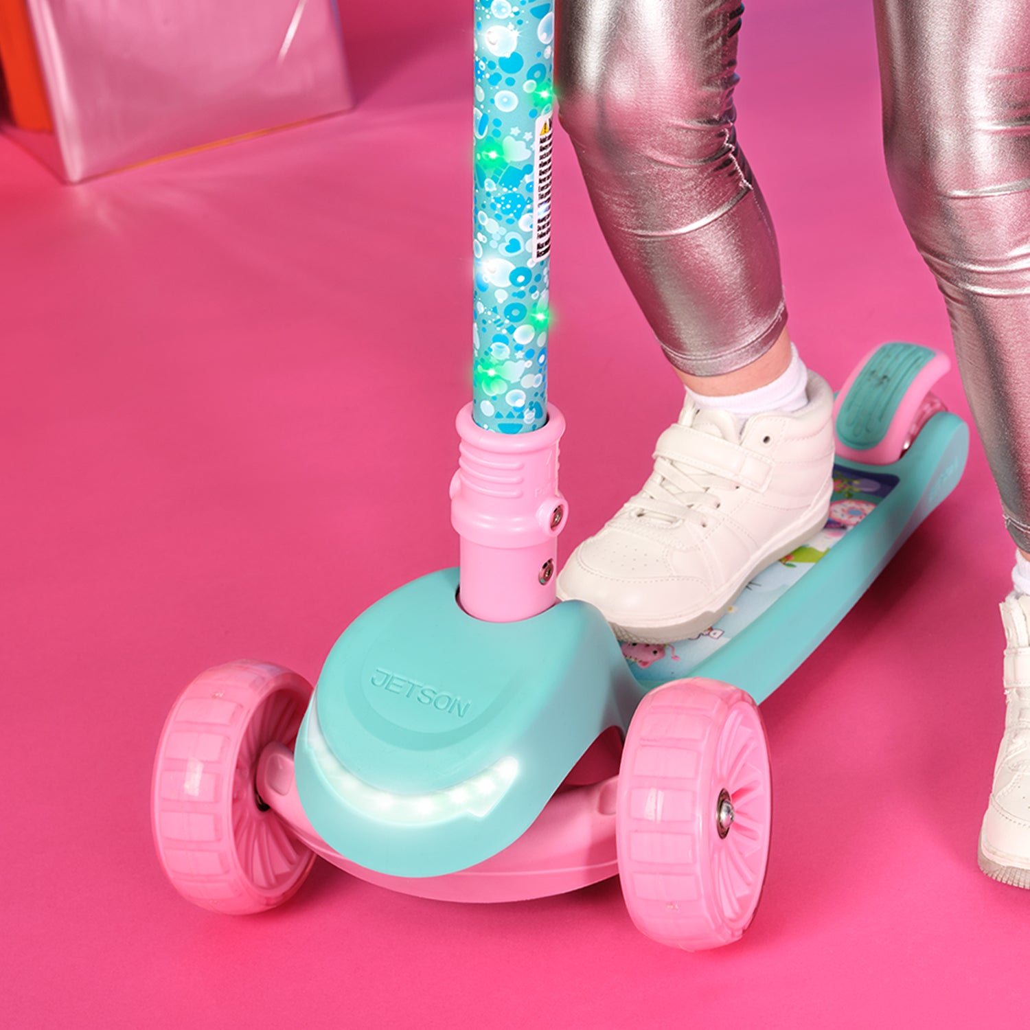 close up of a kid's foot on the gabby's dollhouse kick scooter