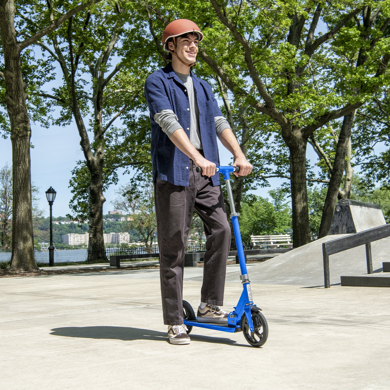 kid riding blue hex kick scooter