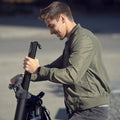 man removing the replaceable battery on the knight scooter