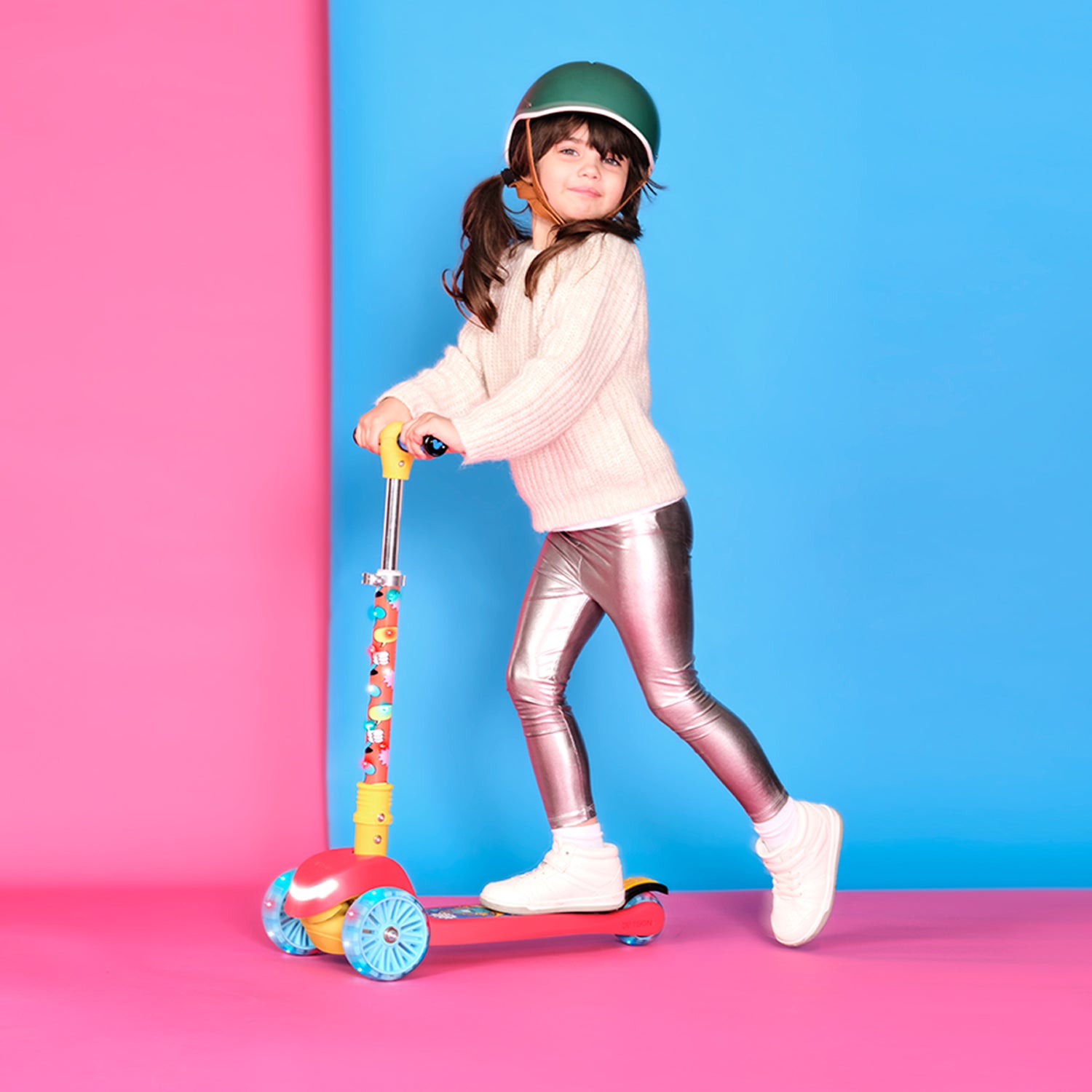 young girl riding mickey mouse kick scooter