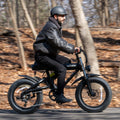 person riding otto electric bike in the woods