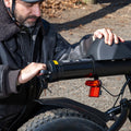 person removing battery on otto electric bike