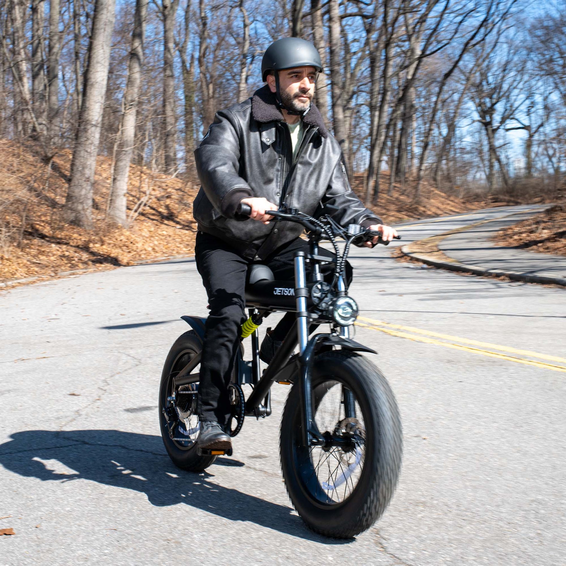 person riding otto electric bike around a corner