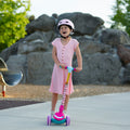 young girl using the lean to steer on the disney princess kick scooter