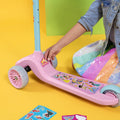 close up of young girl putting stickers on the customizable disney princess kick scooter