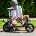 person folding the handlebar and stem down