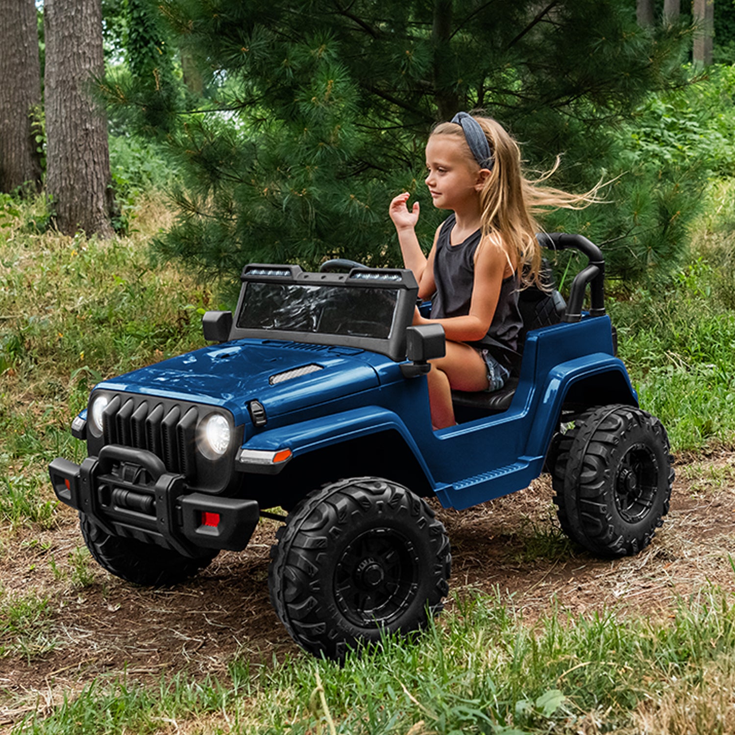 young girl driving safara ride on