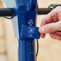 person using nfc card to unlock shield scooter
