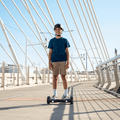 kid riding black spin hoverboard