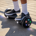 close up of feet on a black spin hoverboard