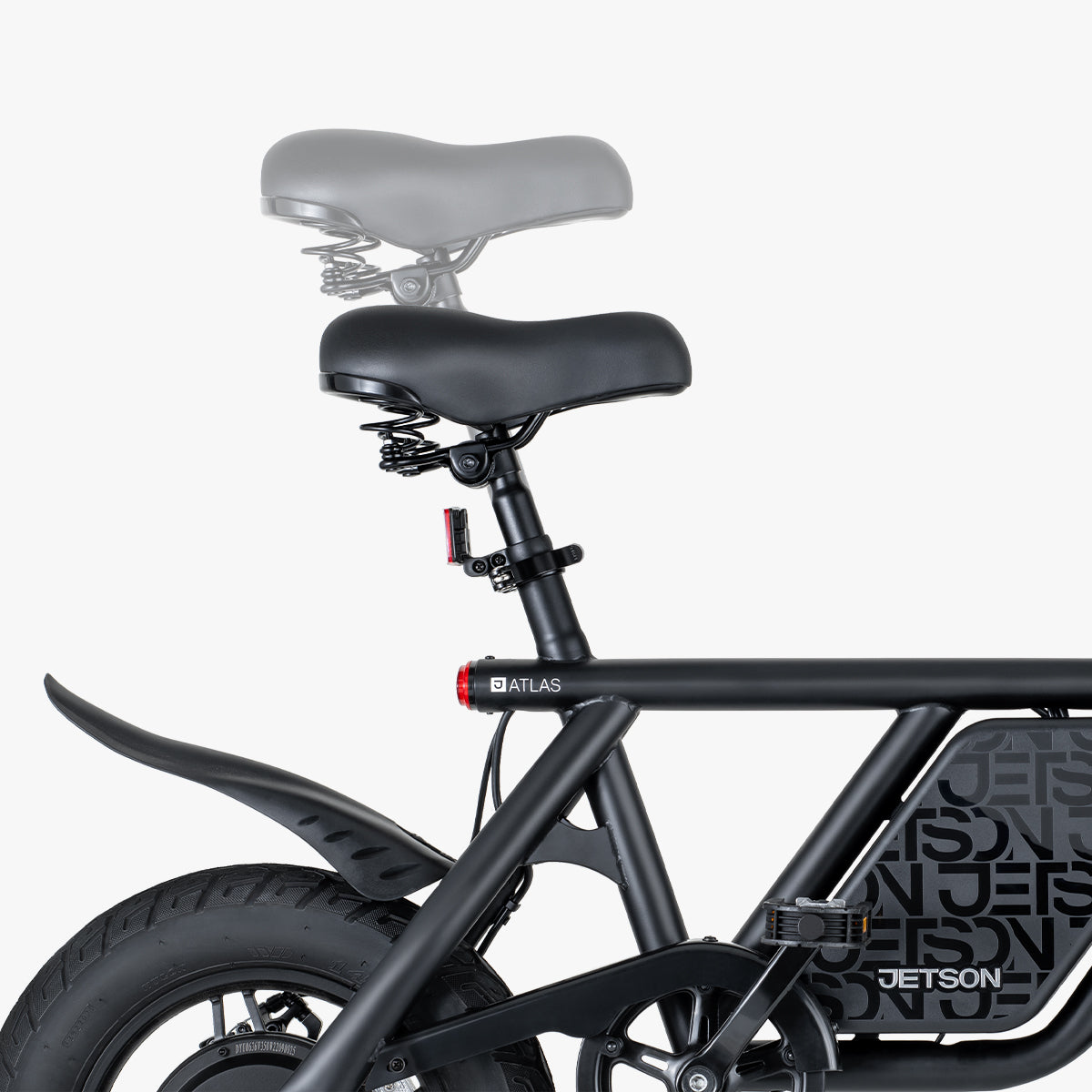 close up of the seat of the Atlas e-bike and it is being demonstrated how the seat height can be adjusted