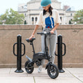 person standing next their Axle bike and looking down at it
