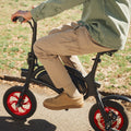 close up of person riding Bolt on a paved path