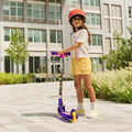 young girl holding the disney encanto kick scooter