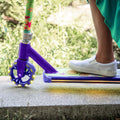 close up of the light up wheel and deck on the disney encanto electric scooter