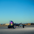 force hoverboard combo with the seat lit up, stopped in a lot