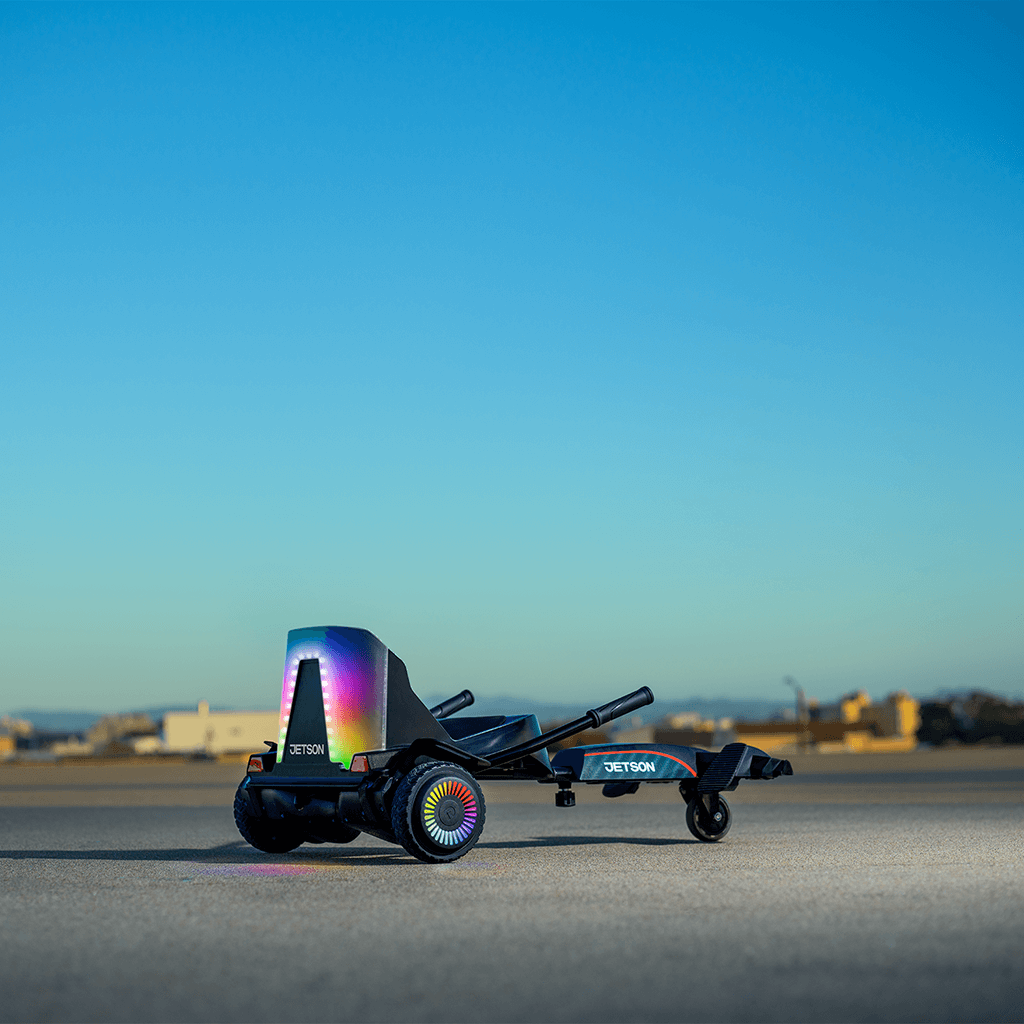 force hoverboard combo with the seat lit up, stopped in a lot