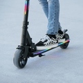 person riding on Highline e-scooter with both feet on the deck