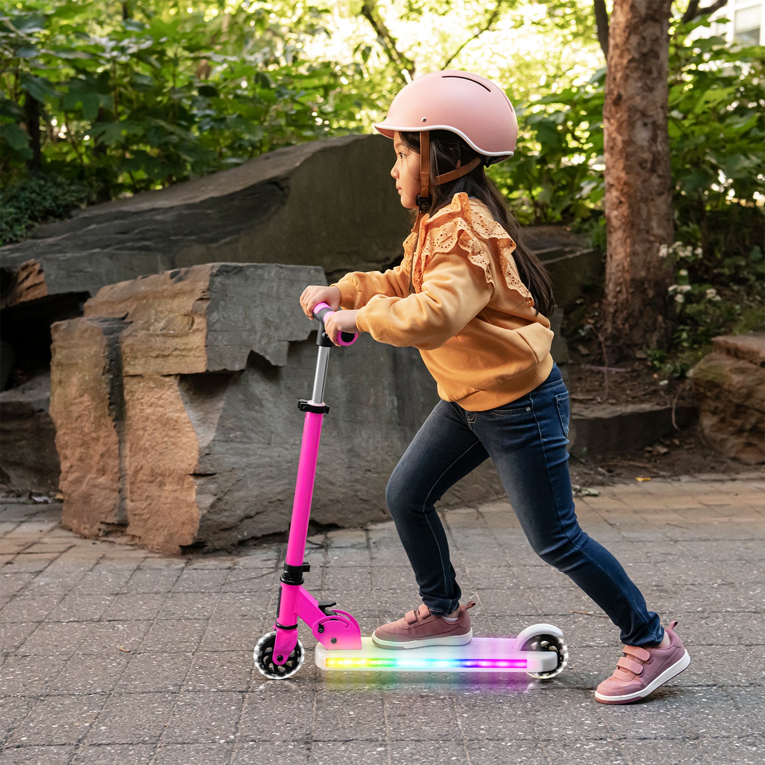 kid riding the pink helio x kick scooter