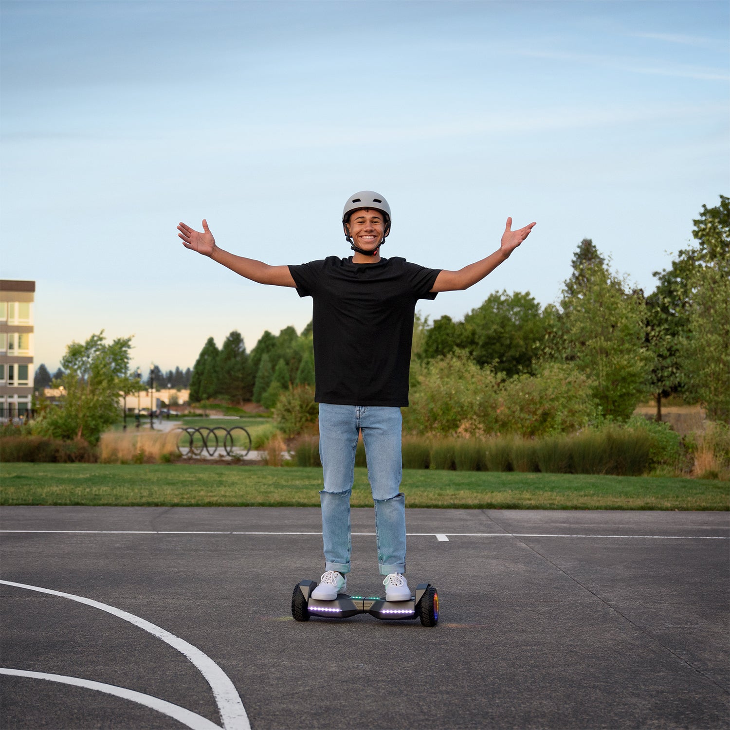 person riding gray impact hoverboard