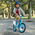 young kid riding blue light rider 16 bike