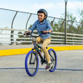 young child riding the JLR X across an overpass