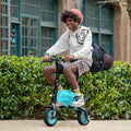 person riding LX10 carrying backpack and smiling
