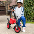 person kneeling down either unfolding or folding their red LX10