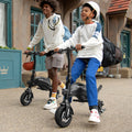two people riding and pushing their LX10s outside