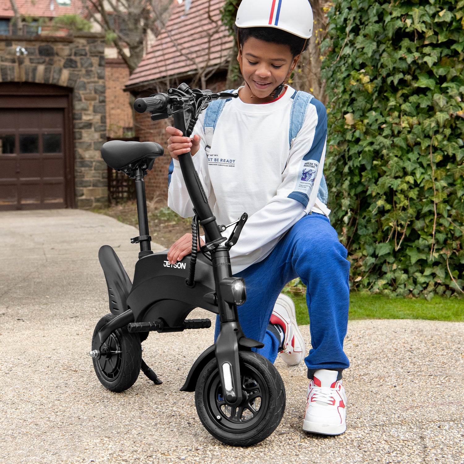 person in the middle of folding or unfolding the handle bars of their LX10