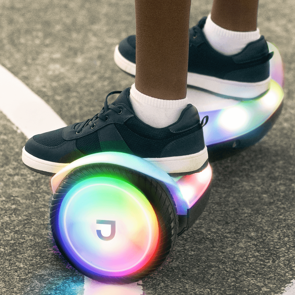 close up of kid standing on black plasma hoverboard