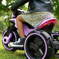 back view of a child sitting on the purple Trooper Electric Ride On
