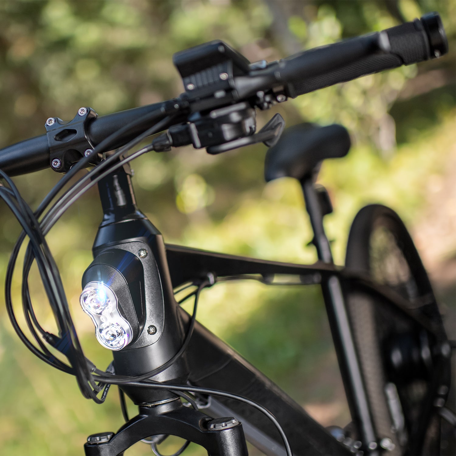 close up of the headlight on the black adventure bike