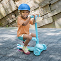 kid seated on the aria 2-in-1 kick scooter