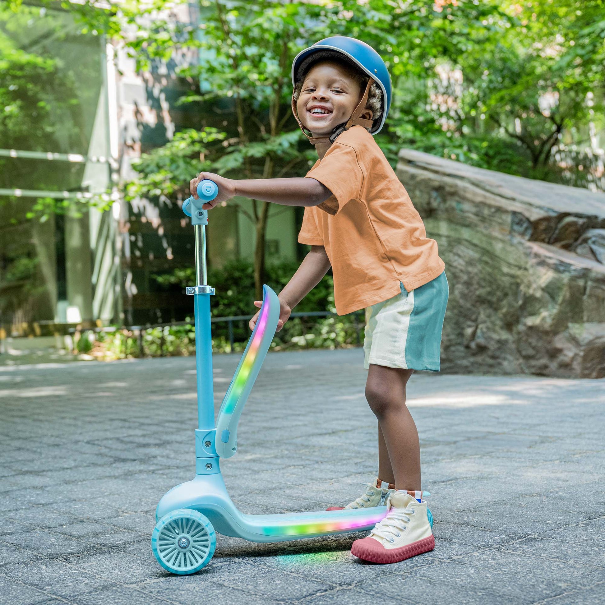 kid folding the seat up on the aria kick scooter