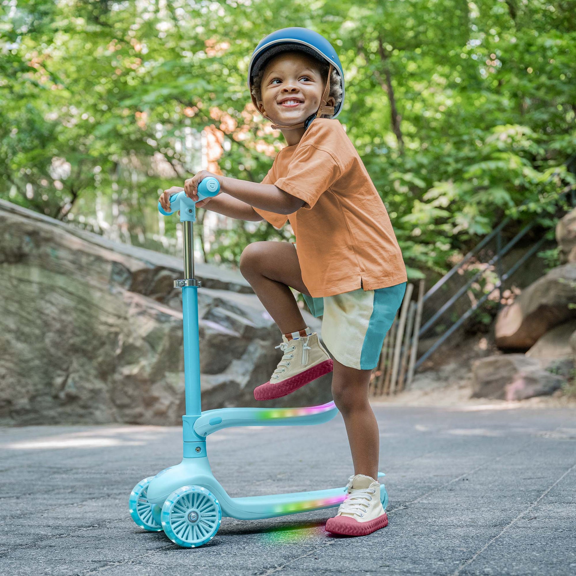 kid stepping onto the aria kick scooter