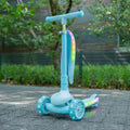 aria kick scooter outside in a park with the seat raised up