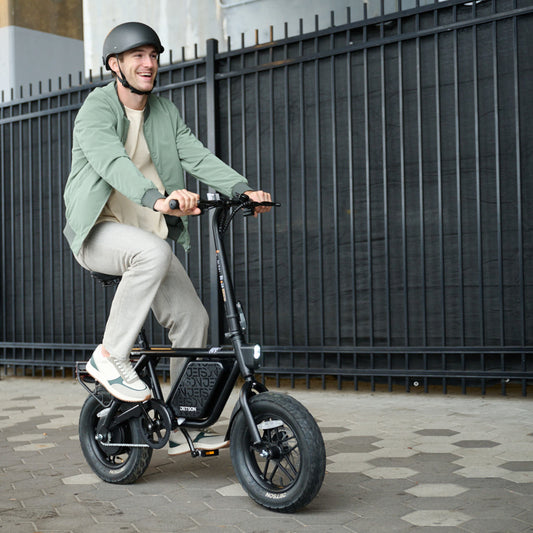 person riding atlas pro electric bike