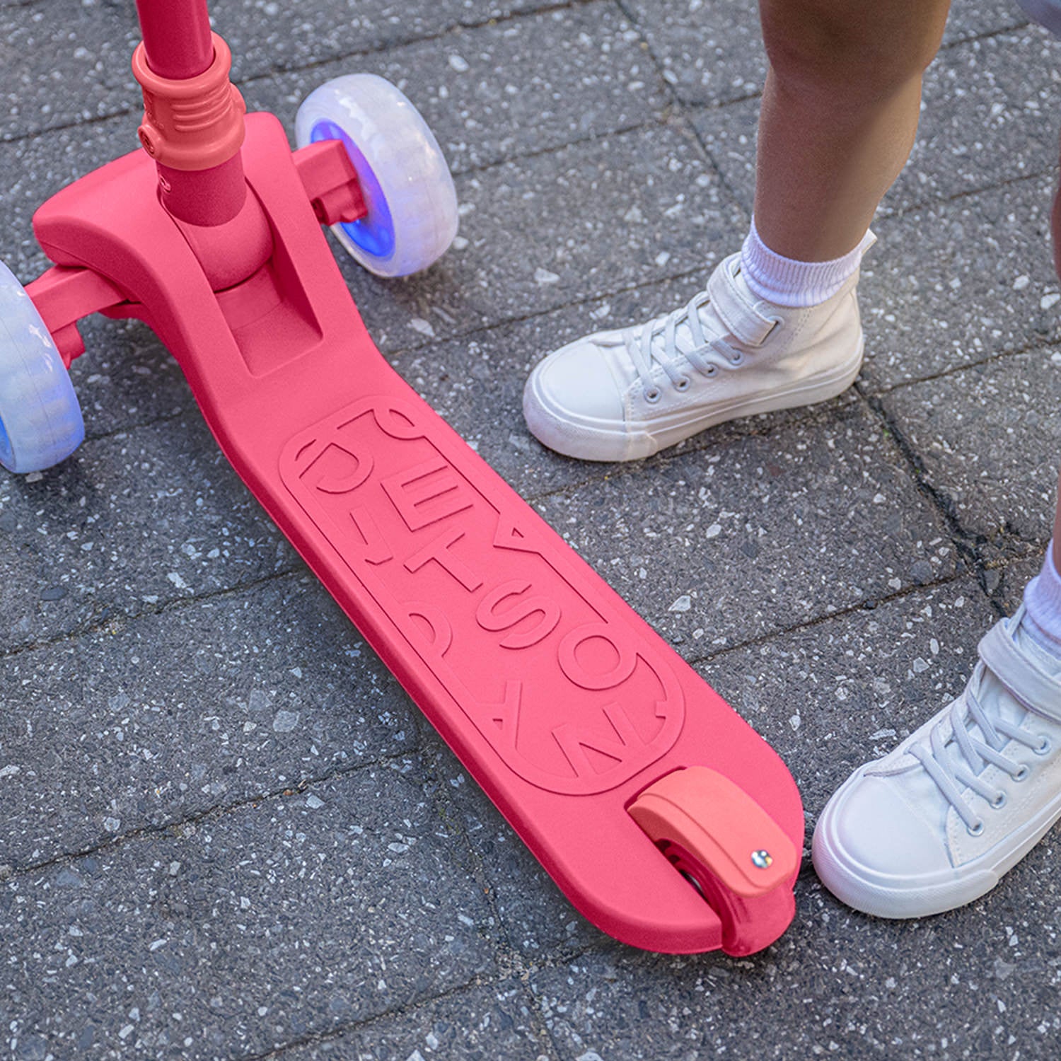 close up of pink bloom scooter deck