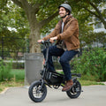 guy riding bolt pro max electric bike in a park