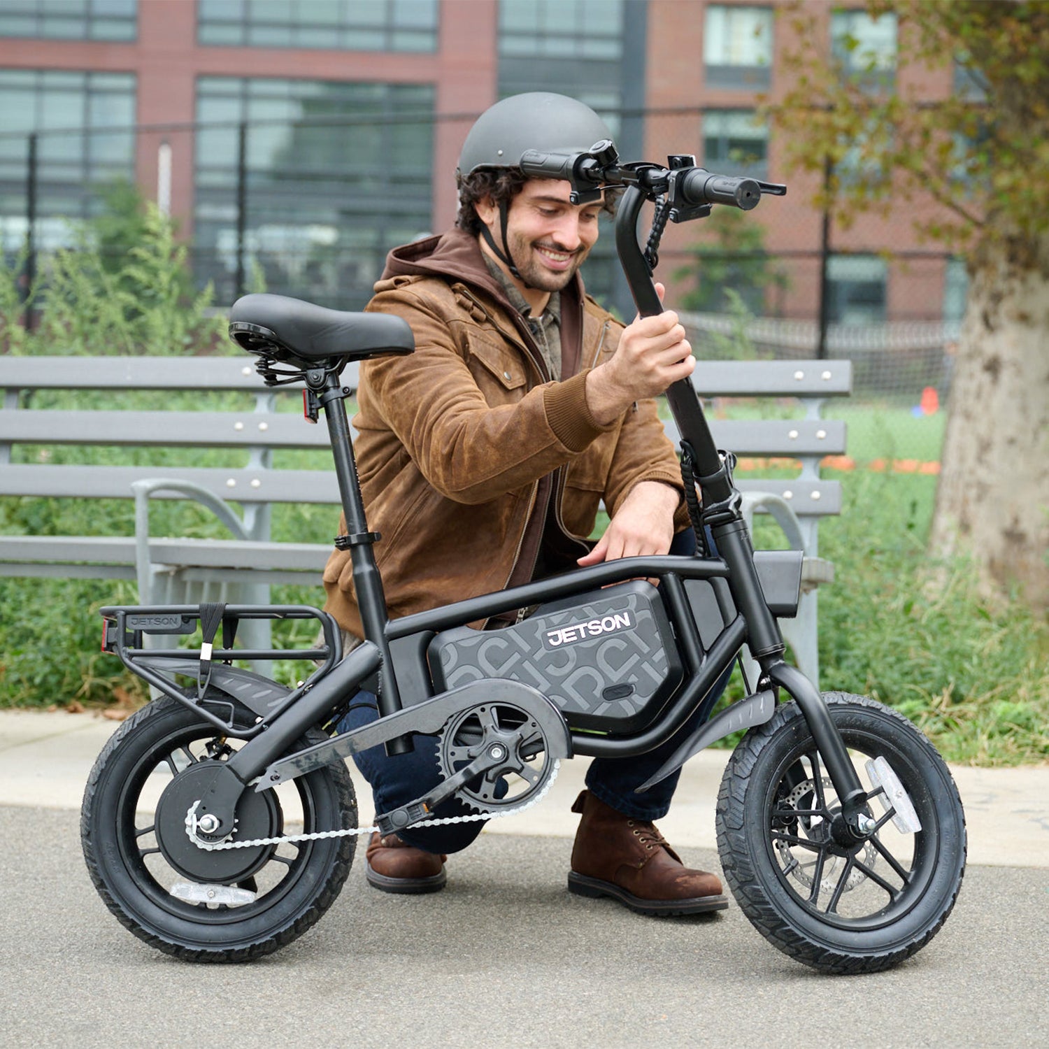 man folding handlebar down on bolt pro max electric bike