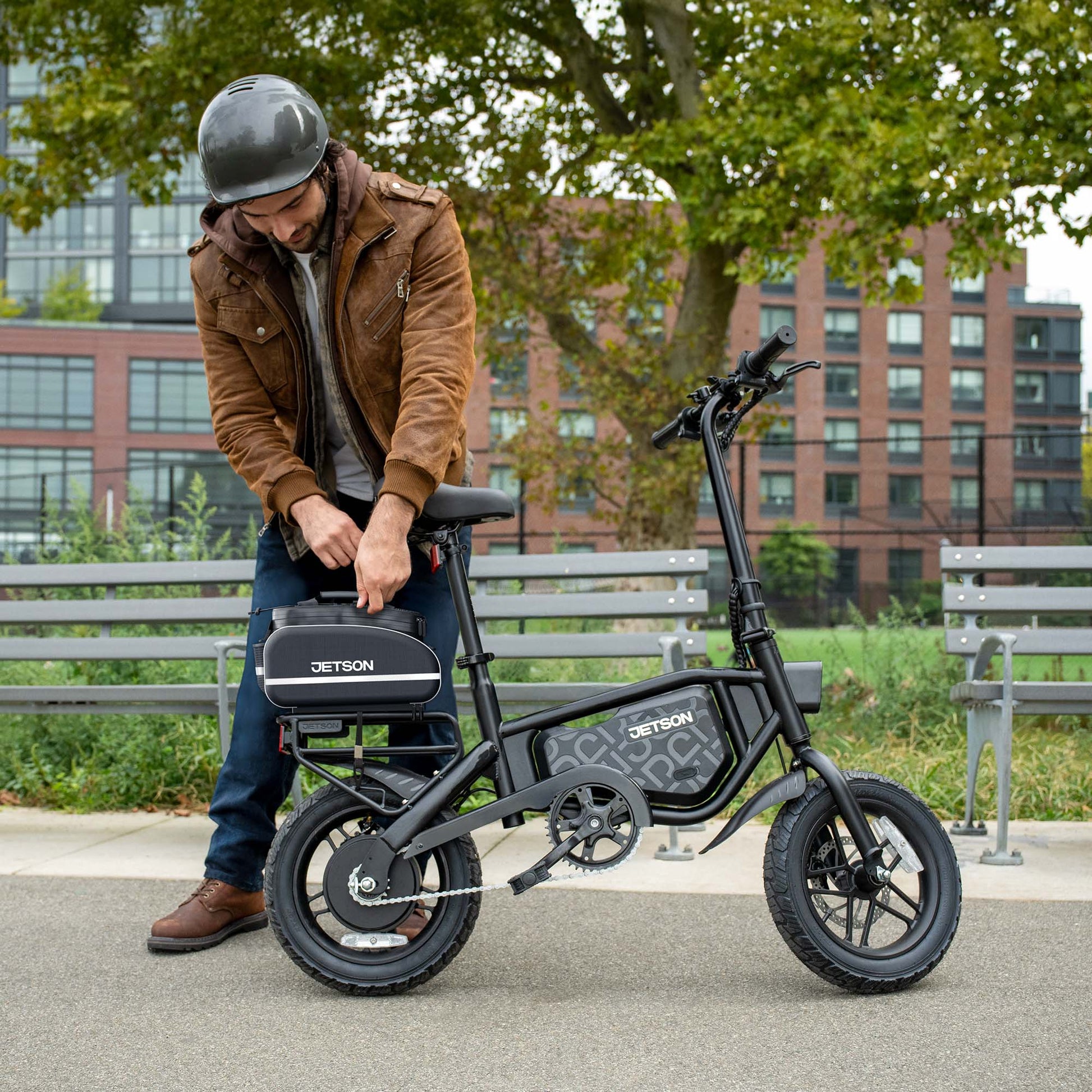 guy closing rackit saddle bag on bolt pro max e-bike