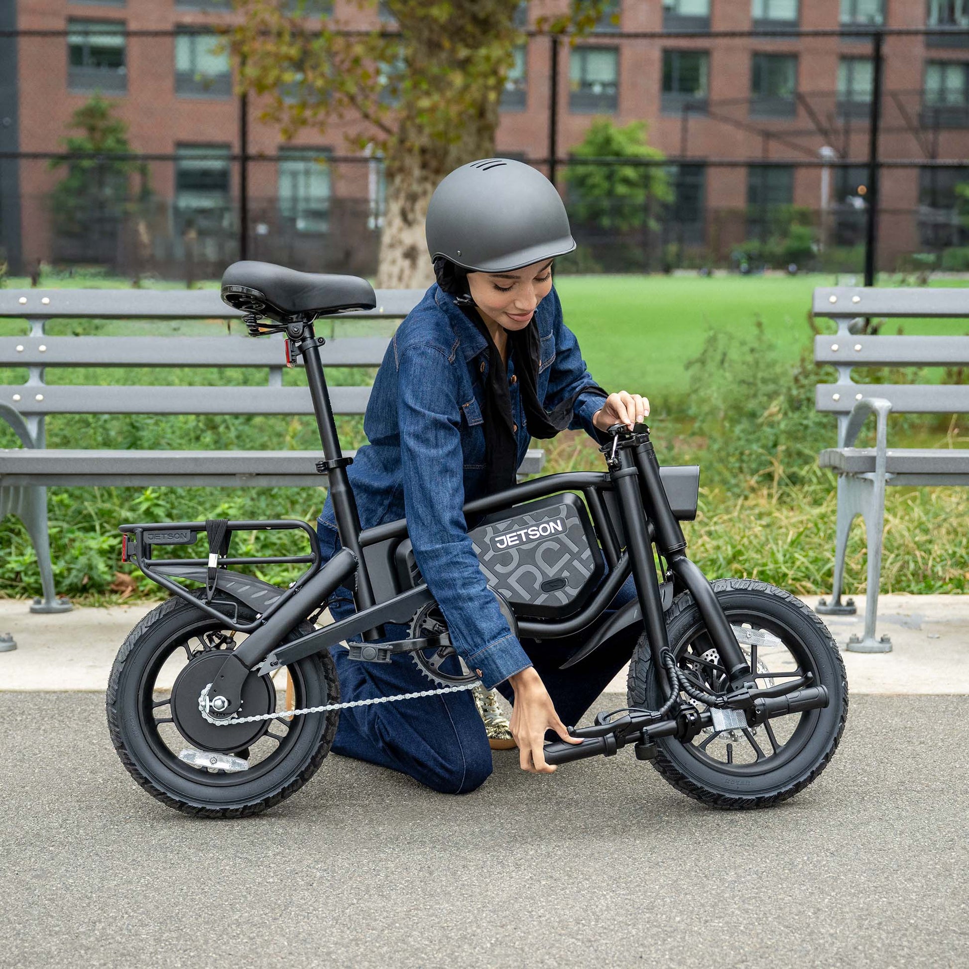 woman lowering handlebar on bolt pro max e-bike