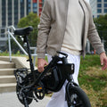 person carrying folded bolt pro x electric bike