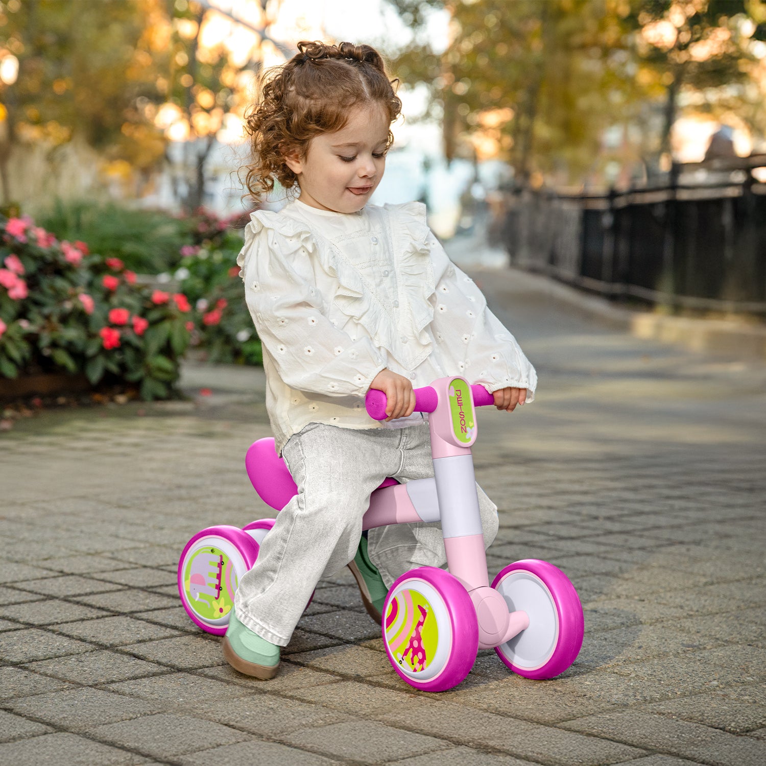 girl riding bounce balance bike