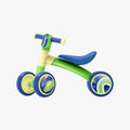 green and blue bounce balance bike side profile view