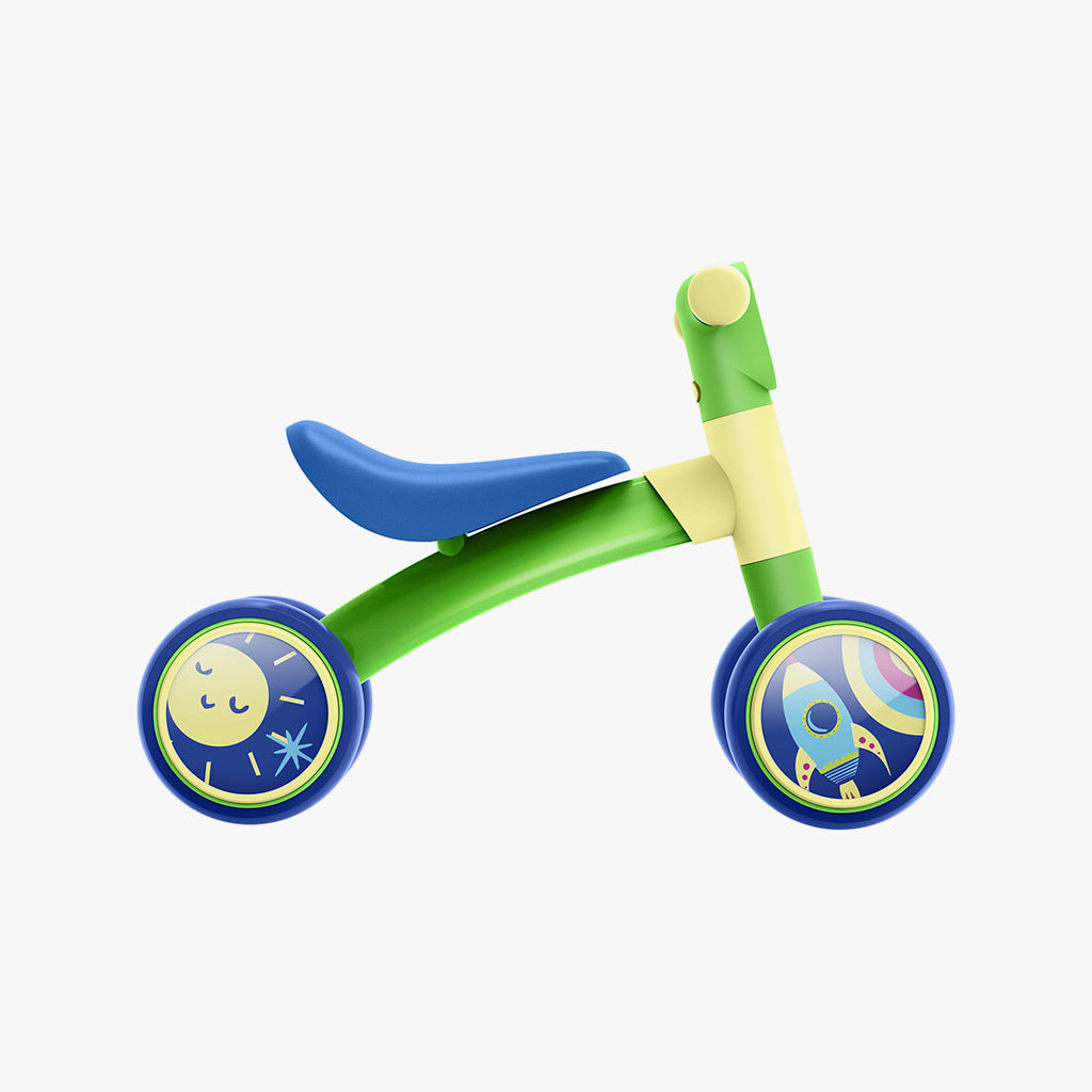 side profile of the green and blue bounce balance bike