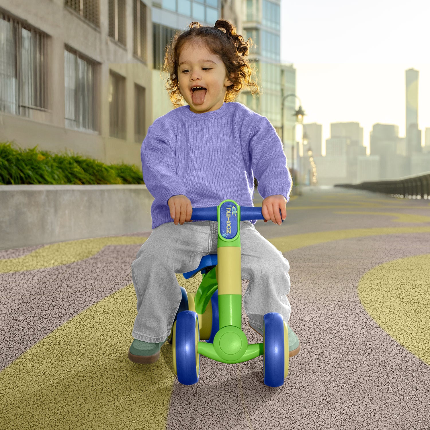 little kid riding blue bounce balance bike